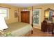 Bedroom featuring a four-poster bed, a window and an antique armoire and dresser at , Hickory, NC 28602