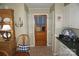 Quaint kitchen area featuring white cabinets, tile floors, and a charming wooden door at , Hickory, NC 28602