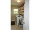 A well-organized laundry room features a modern washer and dryer, window and ample shelving at , Hickory, NC 28602