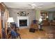 Cozy living room featuring a brick fireplace, hardwood floors, and traditional décor at , Hickory, NC 28602