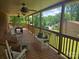 Inviting covered porch with rocking chairs, bench, and ceiling fans, perfect for relaxing and enjoying the outdoors at , Hickory, NC 28602