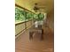 Relaxing covered porch with seating arrangements and a scenic view, perfect for outdoor entertainment and relaxation at , Hickory, NC 28602