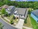 An aerial view shows a well-maintained home with landscaping and a spacious driveway at 1001 Emory Ln, Fort Mill, SC 29708