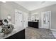 Neutral bathroom with double sinks, tile floors, vanity, and two linen closets at 1001 Emory Ln, Fort Mill, SC 29708