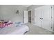 Cozy bedroom with a patterned bedspread, closet, and neutral wall color at 1001 Emory Ln, Fort Mill, SC 29708