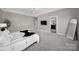 Spacious bedroom with plush carpet, flat screen TV, and en suite bathroom at 1001 Emory Ln, Fort Mill, SC 29708