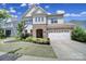 Charming two-story home featuring stone accents, a two-car garage, and a beautifully landscaped front yard at 1001 Emory Ln, Fort Mill, SC 29708