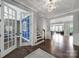 Spacious foyer with hardwood floors, decorative chandelier, and open view to living areas at 1001 Emory Ln, Fort Mill, SC 29708