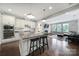 Open-concept kitchen with modern appliances, granite countertops, and seamless flow into the living room at 1001 Emory Ln, Fort Mill, SC 29708