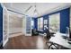 Bright office space with tray ceilings, blue walls, hardwood floors, and ample natural light at 1001 Emory Ln, Fort Mill, SC 29708