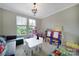 Playroom features ample light from windows, -sized table and art easels at 1001 Emory Ln, Fort Mill, SC 29708