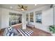 Inviting porch with stylish furniture, a ceiling fan, and views of the backyard at 1001 Emory Ln, Fort Mill, SC 29708