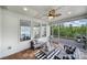 Covered porch with comfortable seating, a ceiling fan, and wood-look floor tiles at 1001 Emory Ln, Fort Mill, SC 29708