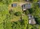 Aerial view of a spacious backyard with a boat, deck, and mature trees offering plenty of privacy at 1001 Old Charlotte Rd, Concord, NC 28027