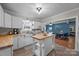 Kitchen with butcher block counters, stainless steel sink, and view of the dining room at 1001 Old Charlotte Rd, Concord, NC 28027