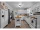 Spacious kitchen features butcher block counters, tile floor, and stainless steel appliances at 1001 Old Charlotte Rd, Concord, NC 28027