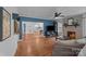 Open-concept living area with hardwood floors, fireplace, and seamless flow to kitchen at 1001 Old Charlotte Rd, Concord, NC 28027