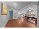 Spacious open floor plan with hardwood floors connecting living, dining, and kitchen areas at 1001 Old Charlotte Rd, Concord, NC 28027
