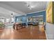 Open-concept living and dining area with hardwood floors and an abundance of natural light at 1001 Old Charlotte Rd, Concord, NC 28027