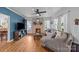 Bright living room with brick fireplace, hardwood floors, and ample natural light at 1001 Old Charlotte Rd, Concord, NC 28027