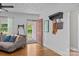 Inviting living room featuring hardwood floors, decorative ceiling, and access to front porch at 1001 Old Charlotte Rd, Concord, NC 28027