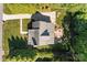 Bird's-eye view of the property, highlighting the roof, patio with fire pit, and lush yard at 1002 4Th Ne St, Conover, NC 28613