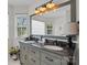 Bathroom with double sink vanity, large mirror and updated light fixtures at 1002 4Th Ne St, Conover, NC 28613