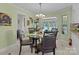 Charming dining area features glass table, decorative chandelier, and entry to half-bath at 1002 4Th Ne St, Conover, NC 28613