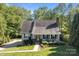 Charming home boasts a manicured front yard, complemented by a welcoming porch and lush landscaping at 1002 4Th Ne St, Conover, NC 28613