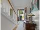 View of the home's foyer, showcasing a staircase, and traditional design features with natural light at 1002 4Th Ne St, Conover, NC 28613