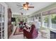 Inviting sunroom style living room with many windows and ceiling fans provides lots of light at 1002 4Th Ne St, Conover, NC 28613