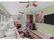Inviting sunroom style living room with many windows and ceiling fans provides lots of light at 1002 4Th Ne St, Conover, NC 28613