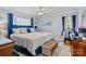 Bright main bedroom with light walls, hardwood floors, area rug, and luxurious blue accents at 1002 4Th Ne St, Conover, NC 28613
