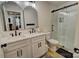 Modern bathroom featuring double sinks, quartz counters, a sleek shower, and updated finishes at 1009 High Shoals Rd, Lincolnton, NC 28092