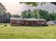 Well-maintained ranch home featuring a classic brick facade and a spacious, green front lawn at 1009 High Shoals Rd, Lincolnton, NC 28092