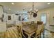 Bright, modern kitchen with stainless steel appliances, center island, and stylish pendant lighting at 1009 High Shoals Rd, Lincolnton, NC 28092