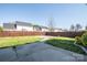 Large open backyard with a concrete patio, lawn and wood privacy fence at 10146 Hawkeye Dr # 2, Charlotte, NC 28273