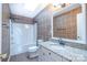 Full bathroom featuring granite countertop, ceramic tile, and combined tub and shower at 10146 Hawkeye Dr # 2, Charlotte, NC 28273