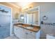 Bright bathroom featuring a double sink vanity with granite countertop and tile backsplash at 10146 Hawkeye Dr # 2, Charlotte, NC 28273