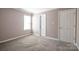 Bedroom features neutral walls, carpet floors and natural light through a window at 10146 Hawkeye Dr # 2, Charlotte, NC 28273