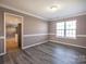 Elegant dining room featuring hardwood floors, trim accents and a view to the kitchen at 10146 Hawkeye Dr # 2, Charlotte, NC 28273