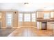 Bright kitchen featuring tile floors, stainless appliances and an adjacent dining area at 10146 Hawkeye Dr # 2, Charlotte, NC 28273
