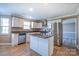 Modern kitchen featuring stainless steel appliances, center island with granite counters and white cabinetry at 10146 Hawkeye Dr # 2, Charlotte, NC 28273