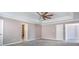 Large main bedroom with tray ceiling, ceiling fan, and access to ensuite bathroom at 10146 Hawkeye Dr # 2, Charlotte, NC 28273