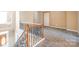 Staircase with wooden and metal banister leading to the upper level at 10146 Hawkeye Dr # 2, Charlotte, NC 28273