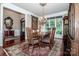 Elegant dining room with hardwood floors, chandelier, and ample space for entertaining guests at 112 Eagle Chase Ln, Troutman, NC 28166