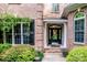 Beautiful front entry with brick detail, charming planters, and decorative black shutters at 112 Eagle Chase Ln, Troutman, NC 28166