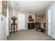 Hallway features neutral paint, beautiful wood railing, and a lovely table with decor at 112 Eagle Chase Ln, Troutman, NC 28166
