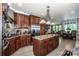 Gourmet kitchen with island and stainless steel appliances. Adjacent to the eat-in kitchen area at 112 Eagle Chase Ln, Troutman, NC 28166