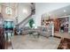 Inviting living room with hardwood floors, staircase, and open floor plan to the kitchen at 112 Eagle Chase Ln, Troutman, NC 28166